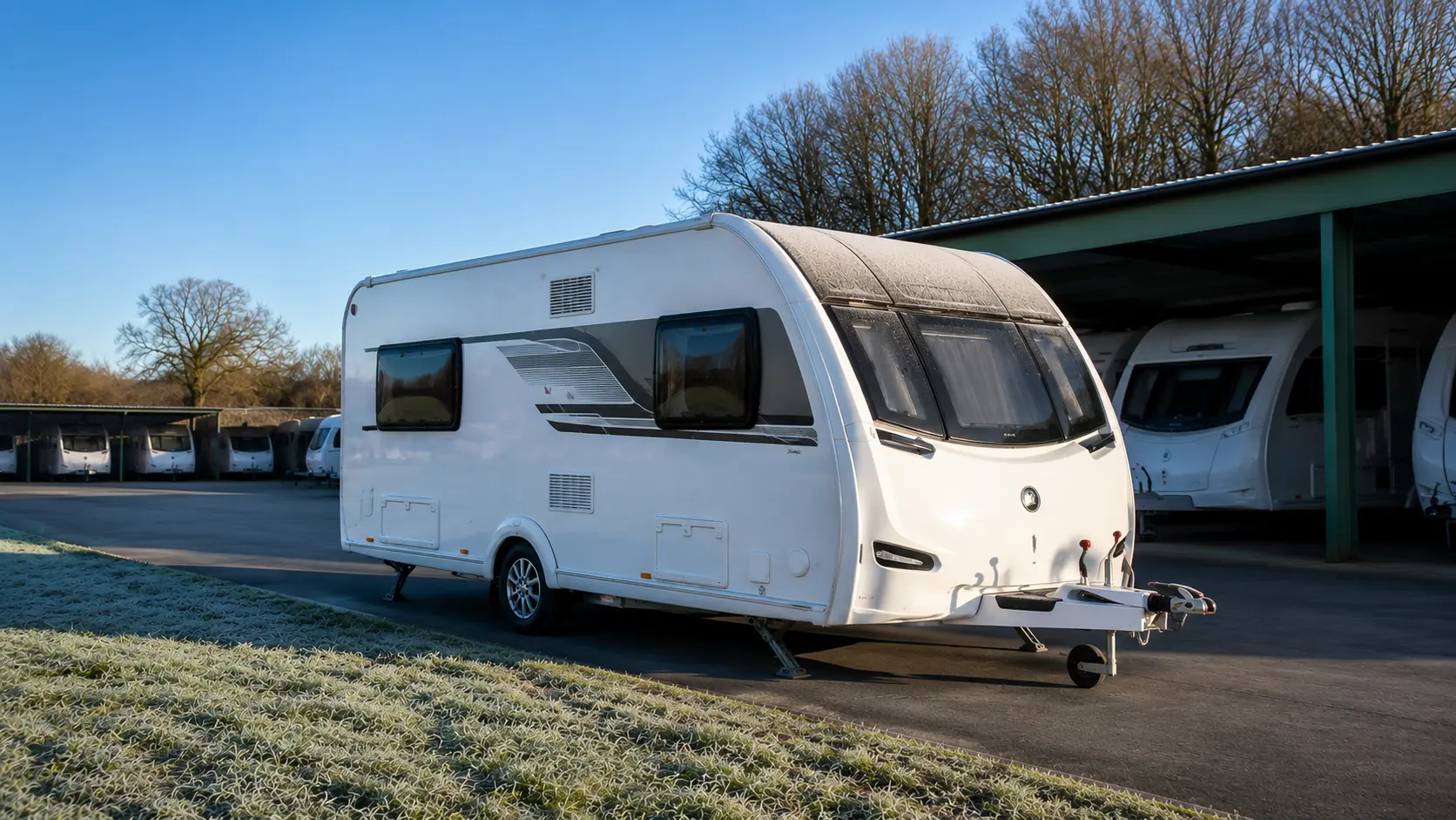 Modern UK touring caravan stored safely during winter at a secure storage compound