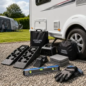 Caravan levelling ramps and wheel chocks beside a touring caravan
