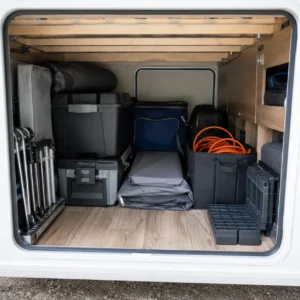 Organised storage area inside a UK touring caravan showing balanced loading