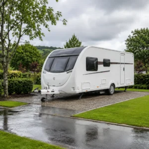 UK touring caravan on a hardstanding pitch after rain