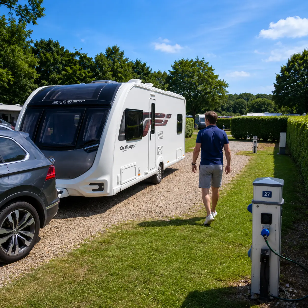 Caravanner inspecting campsite pitch