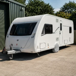 Touring caravan stored with tyre covers fitted
