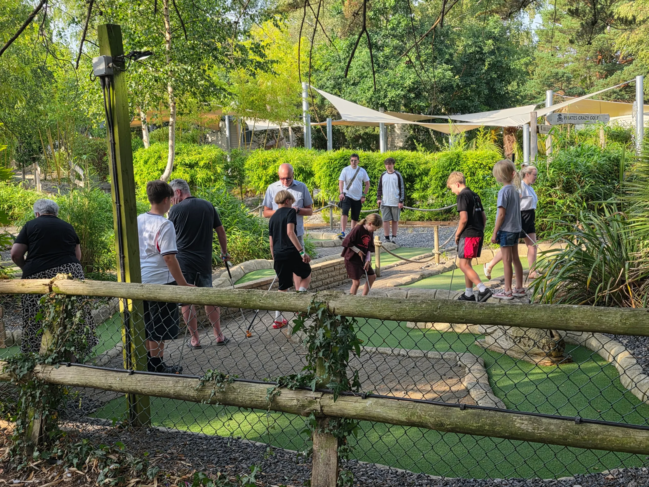 Family enjoying their caravan holiday during a four-night stay at Sandford Holiday Park in Dorset.