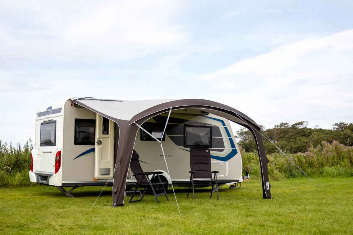 Telta Anholt Reclining Chair set up outside a Coachman touring caravan on a campsite pitch